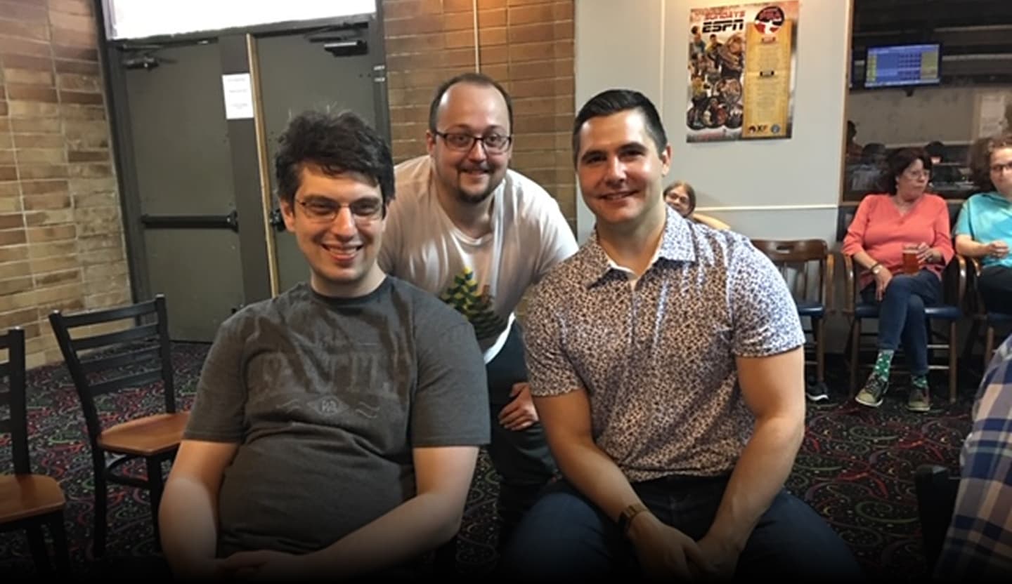 Jason with clients at a bowling event
